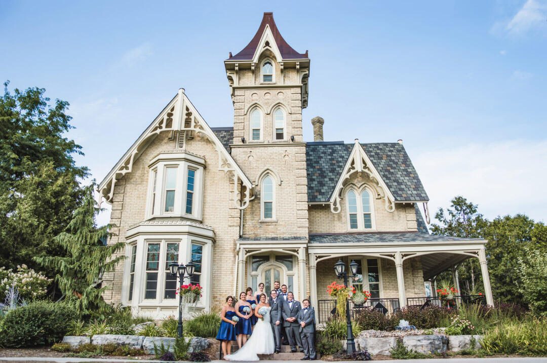 Untitled Wedding party standing on steps of the Elm Hurst Inn