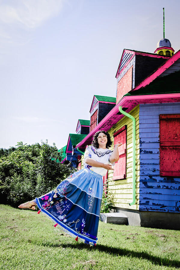 Styled Shoot - Mirabel cosplay dancing in front of colourful house